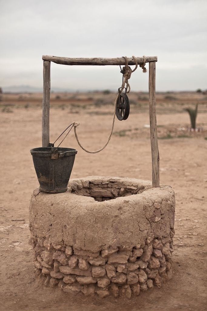 Photo of a stone well.